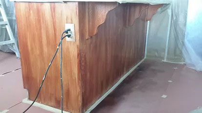 Cabinet refinishing service with restored wood cabinetry
