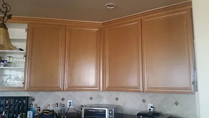 Cabinet staining service highlighting natural wood grain